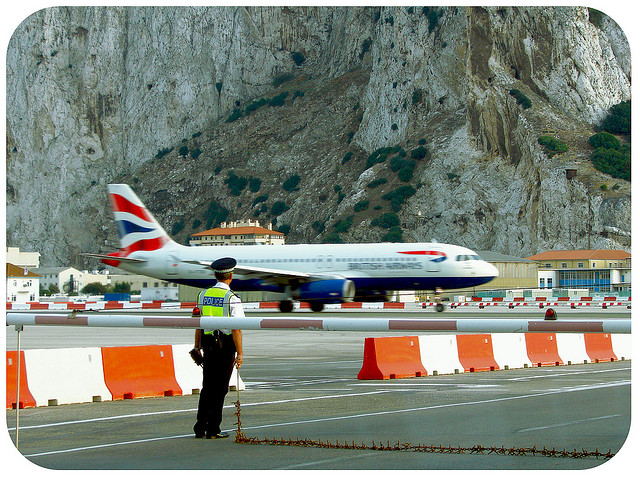 Plane at Gibraltar airport crossing the road