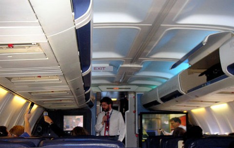 Flight attendant puts child in overhead bin