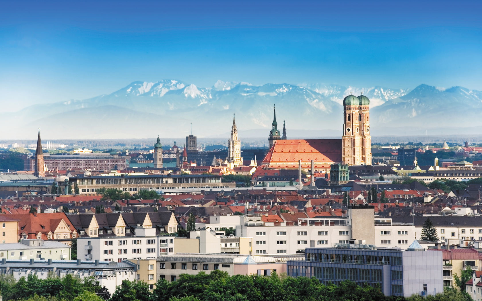 view over Munich with the Alps in the background