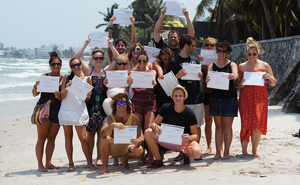 TESOL graduates pose for a photo with their TESOL graduation certificates in Hua Hin, Thailand