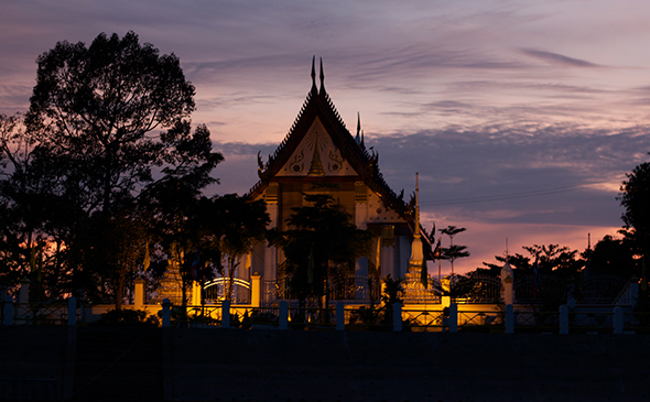 Thai temple glowing after sunset in Chiang Mai