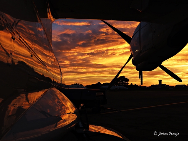 The sunrise reflecting onto the ATR42.