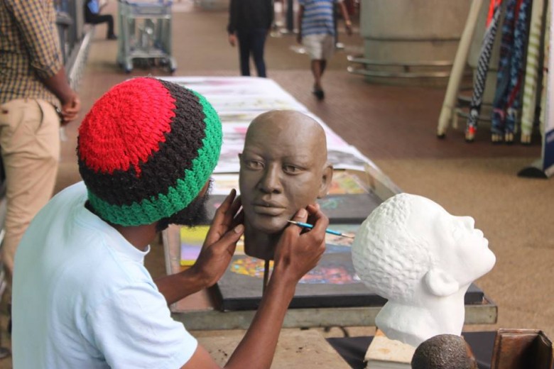 sculptor at King Shaka Airport Heritage market