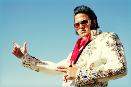 Man in Elvis costume posing