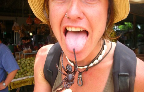 Levonne tastes a local delicacy in Cambodia.