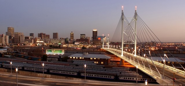 Johannesburg skyline with Nelson Mandela Bridge in the foreground.