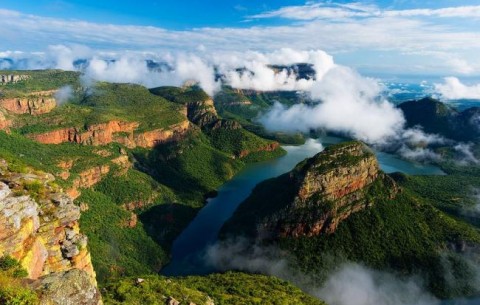 Clouds breaking over a green Blyde River Canyon