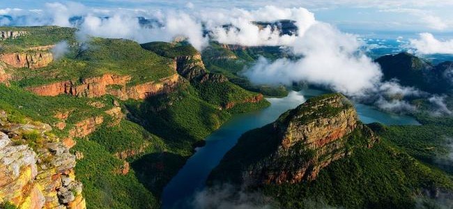 Clouds breaking over a green Blyde River Canyon