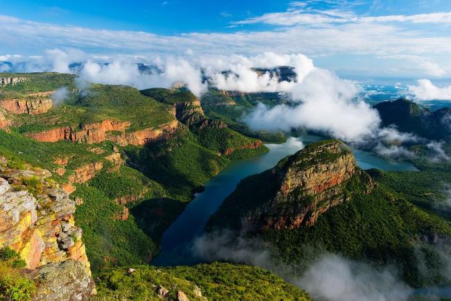 Clouds breaking over a green Blyde River Canyon