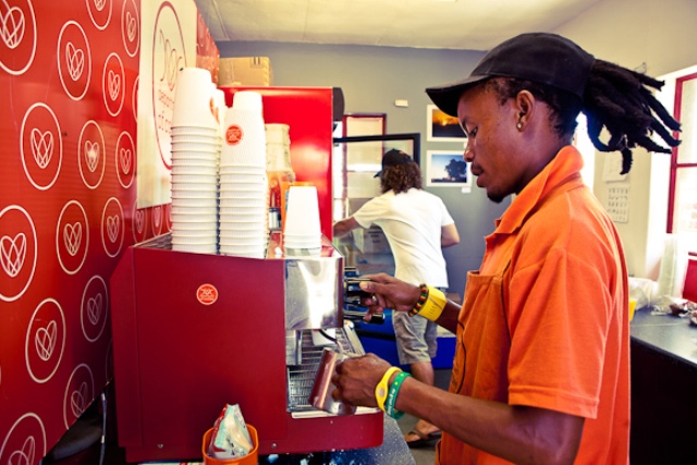 A barista pours coffee at the Department of Coffee in Khayelitsha, Cape Town.