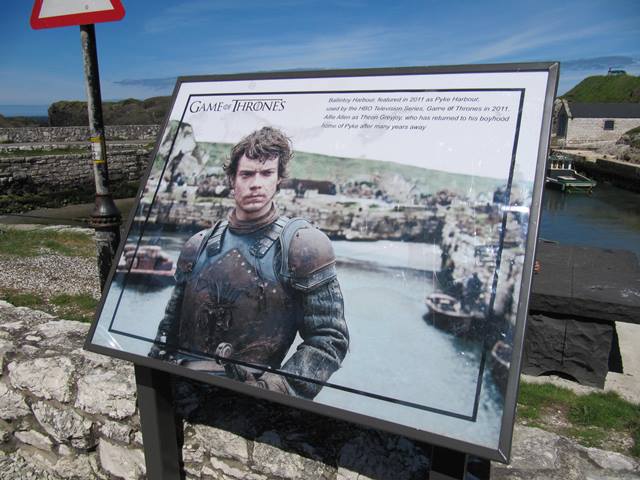 A sign depicting Theon Greyjoy in Game of Thrones at Ballintoy Harbour, Northern Ireland.