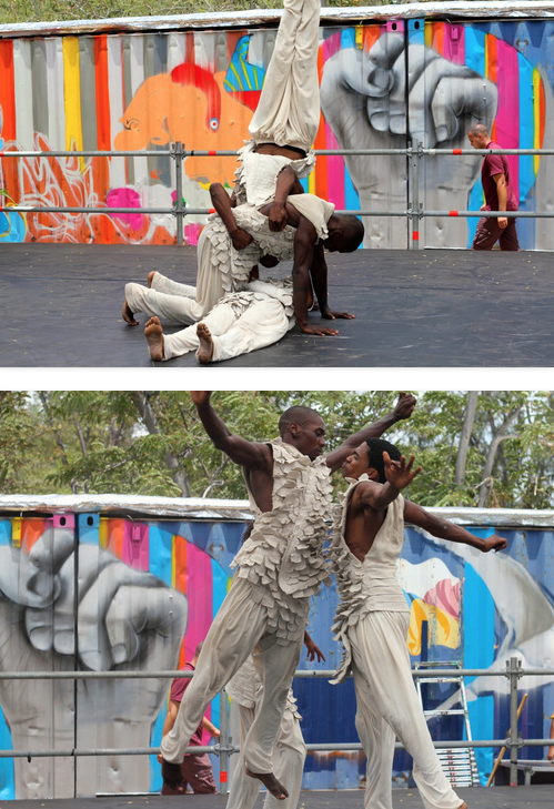 Traditional Dancers fly into the air.