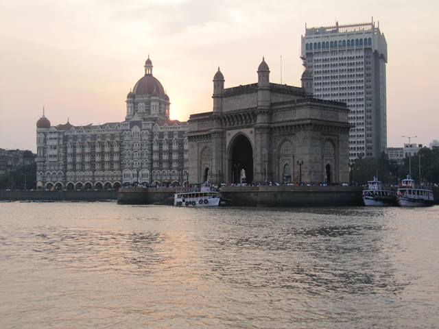 The Gateway of India in Mumbai, India. The famous Taj Hotel is in the background.
