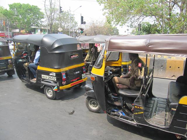 Tuk Tuks fight traffic in Mumbai, India.