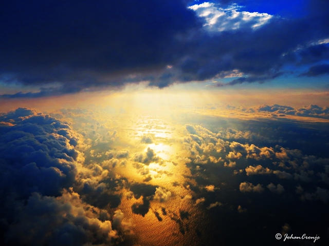 Sun set over the ocean. Flying along the coastline to Libreville, Gabon.