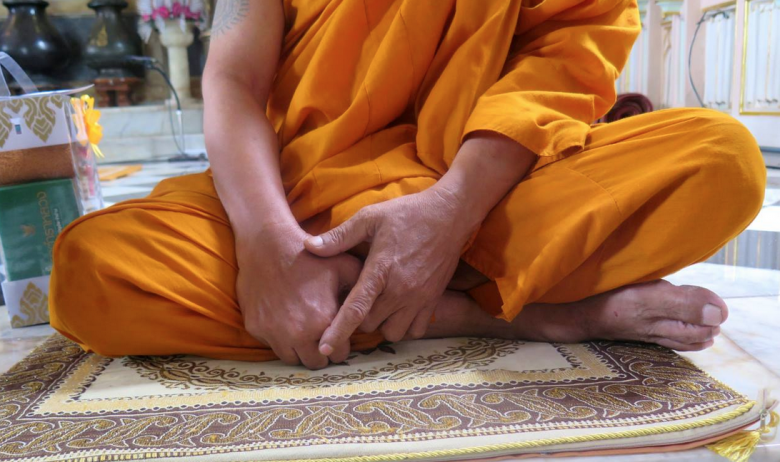 A monk in one of the temples, offers advise to the followers.