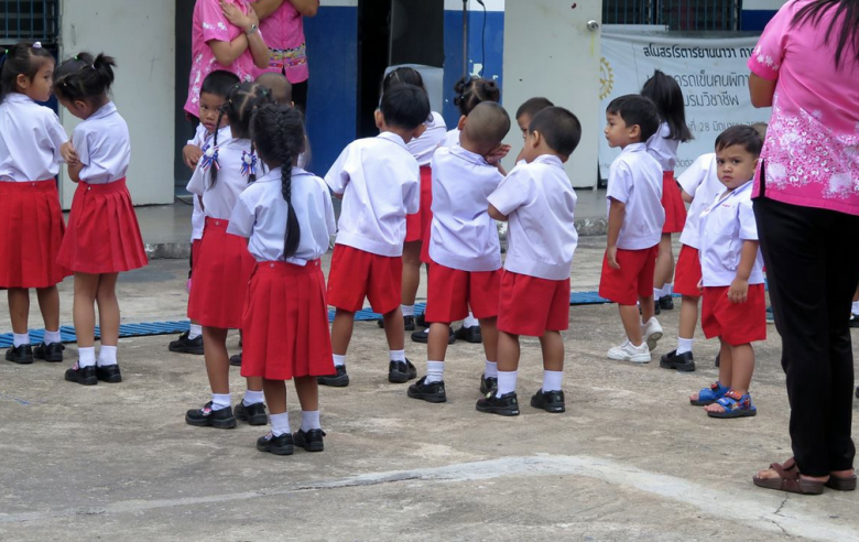 Stopped at a school to watch these children sing and play.