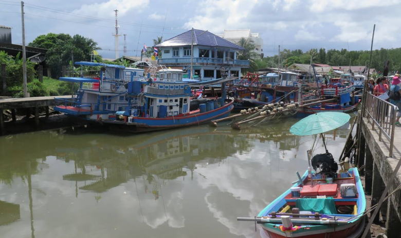 The Ban Nam Chiao canal with its colourful fishing boats.