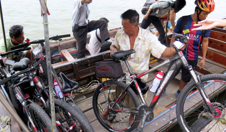 Loading the bikes for the river crossing.