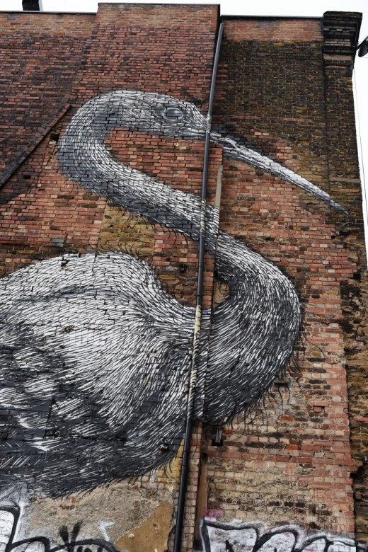 A giant bird overlooking Target ‘A’ bomb site on Hambrei street, London. Roa’s signature style of giant sketched animals marks his artworks.