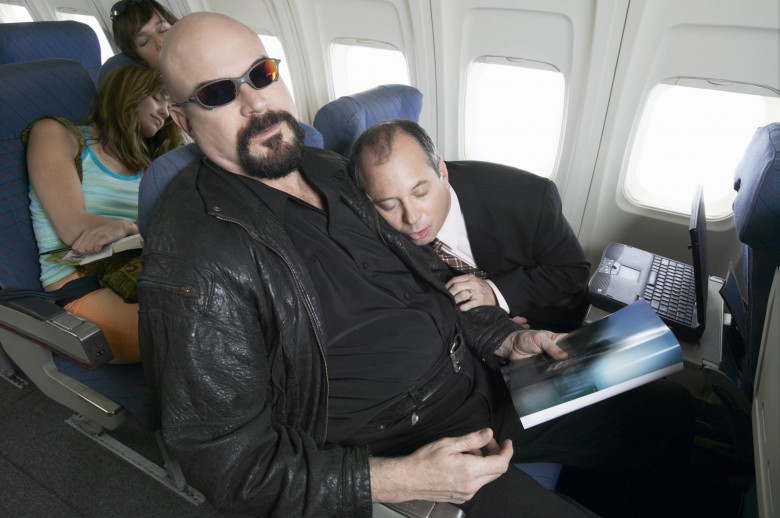 Plane Interior, Businessman Falling Asleep on the Man Sitting Next to Him