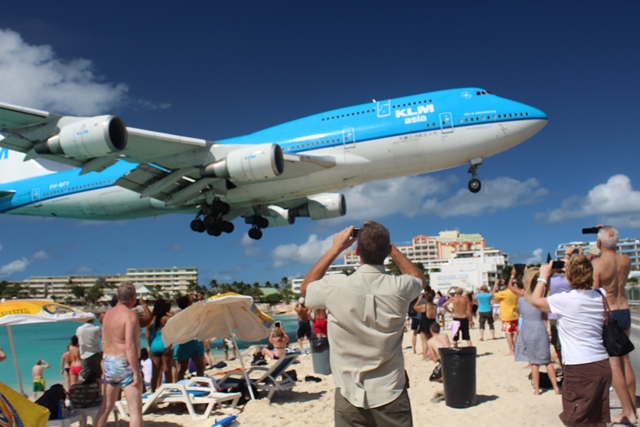 KLM's Boeing 747 flies low over Maho Beach as it arrives at Princess Juliana Airport in St. Maarten.