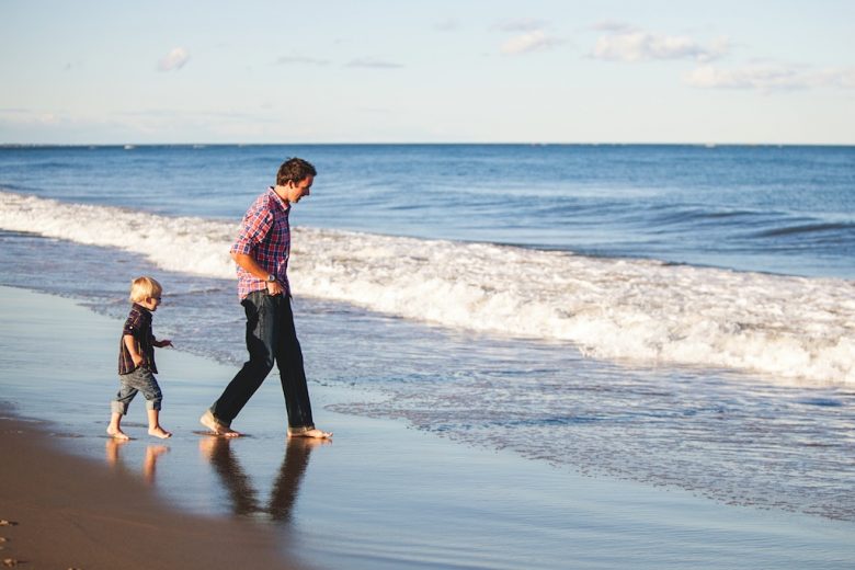 little boy with father at the sea on holiday