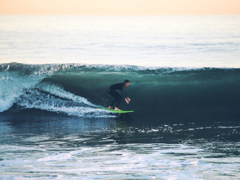 Riding a wave at Graveyards Mauritius Surf