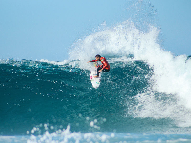 Surfing the waves at Harbour Rivière Noire Mauritius Surf