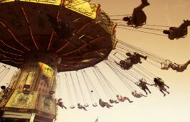 People enjoying a swing ride at a festive amusement park in Johannesburg during December 2025, capturing the fun and adrenaline of things to do in Johannesburg during the summer holiday season.