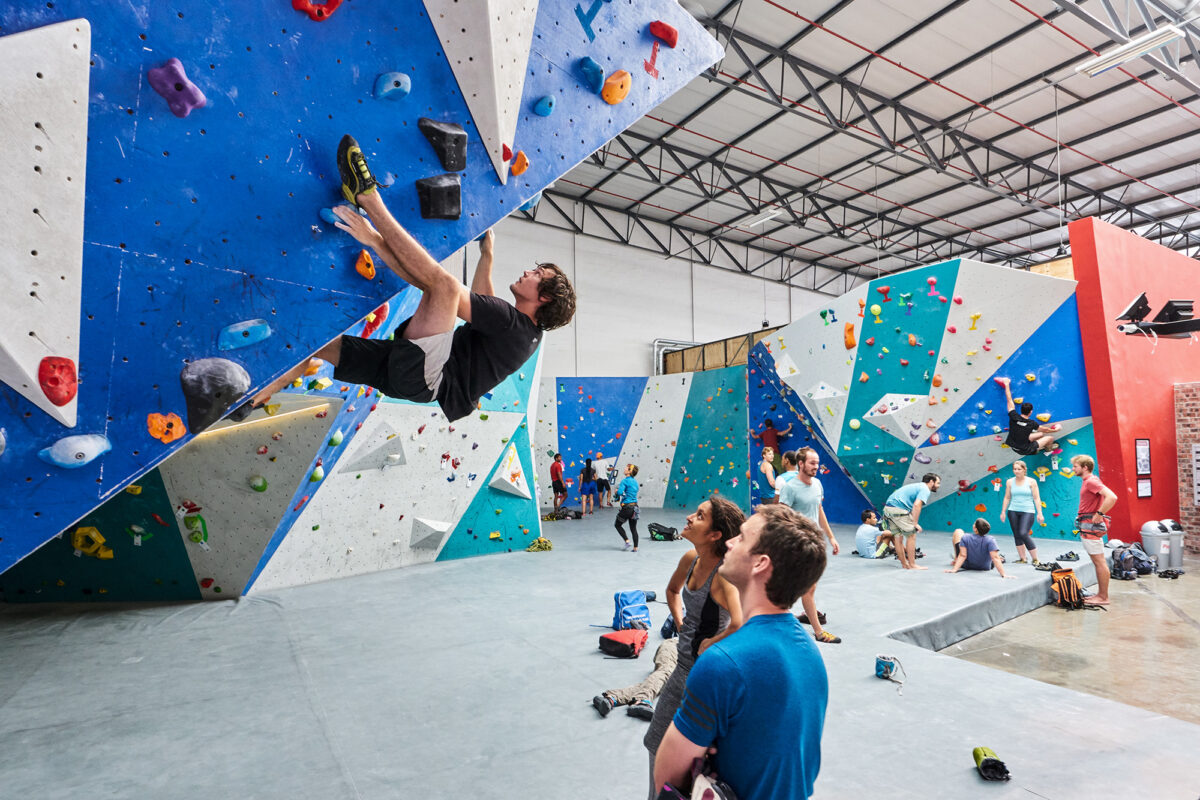 CityROCK climbing gym
A man climbs a steep indoor bouldering wall while others watch and cheer inside CityROCK Cape Town, a fun and active way to stay warm in winter.