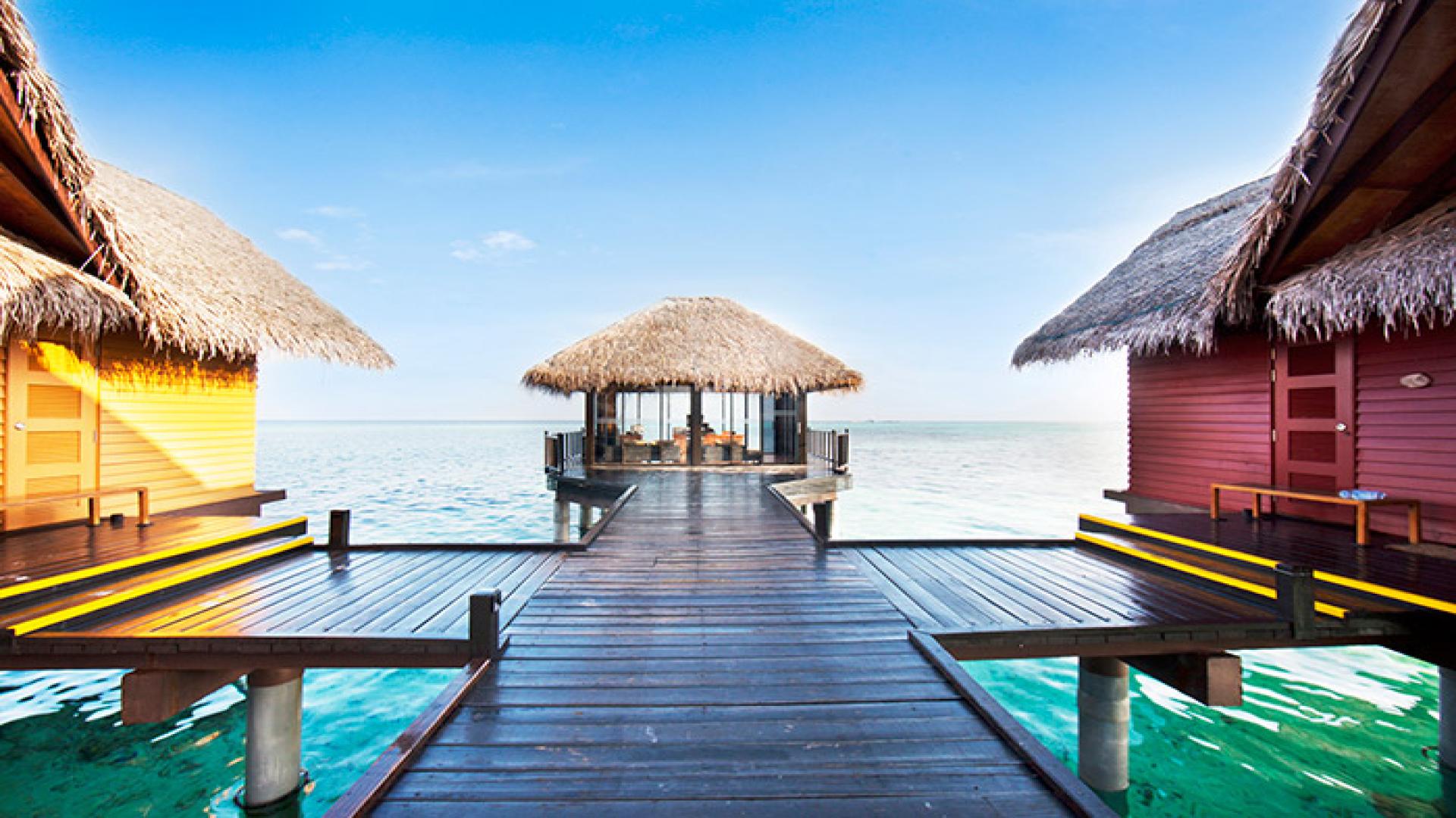 Thatched over-water huts in Maldives one of the most visited destinations by South Africans during the Easter Holidays