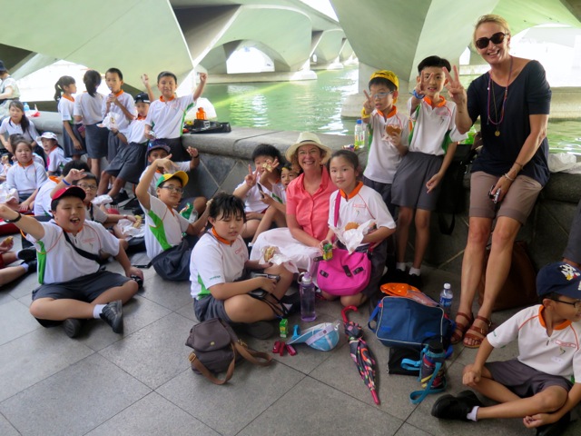 Singapore School Children Smile! Dawn poses with a group of school children on a outing.