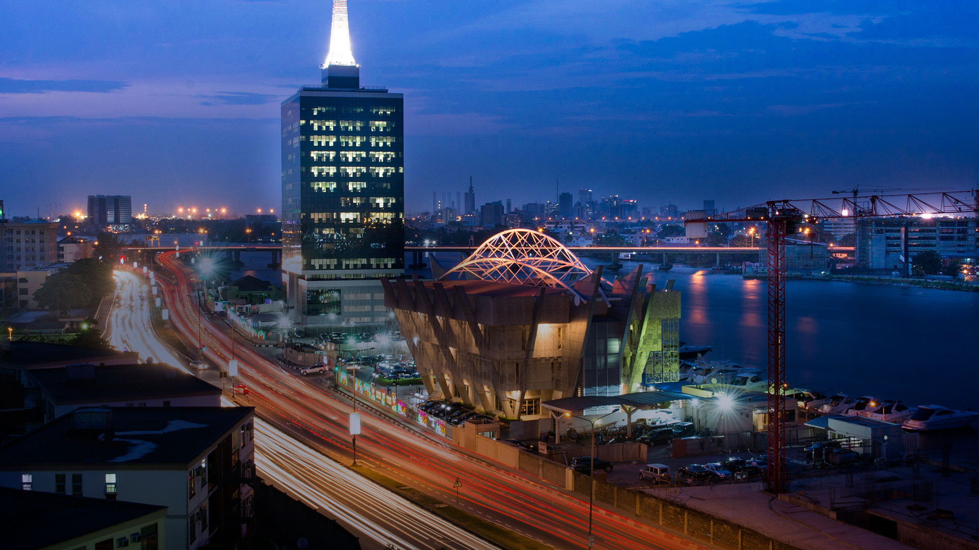 Night view of the Lagos skyline in Nigeria. This is one of the top holiday destinations for south africans to visit in 2025