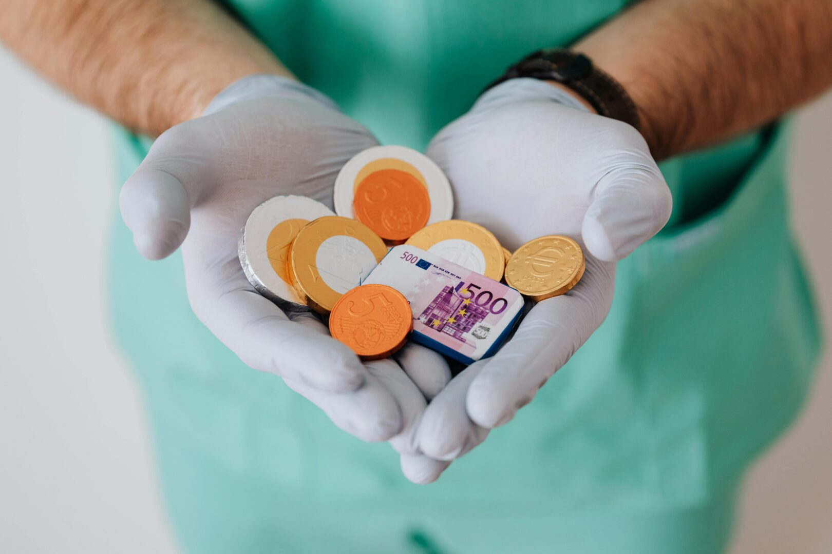 Health professional holding coins and notes instead of pills, showing how expensive medical emergencies are in another country and how important travel insurance is.