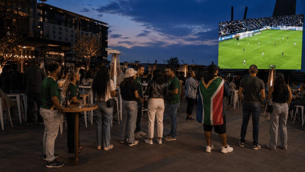 A crowd gathered outdoors to watch the 2026 FIFA World Cup in South Africa