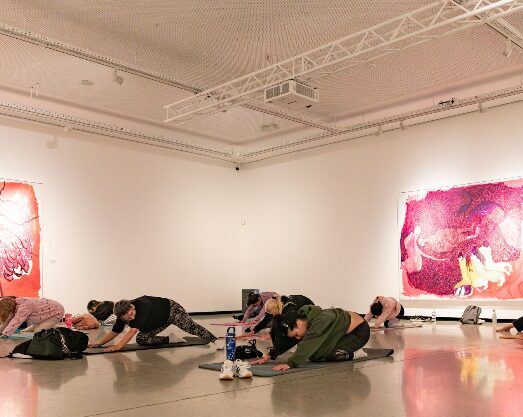 People doing pilates in an exhibit at Norval Foundation, as in event advertised in Cape Town this July.