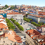 Lisbon Rossio Square Lisbon Portugal with wavy cobblestone pavement fountain and historic buildings