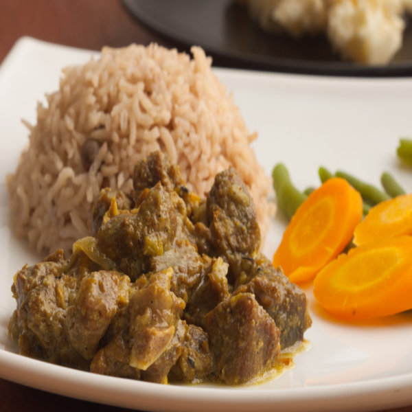 Abuja Curried Goat Served With Ofada Rice