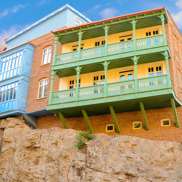 Tbilisi brick building green balcony