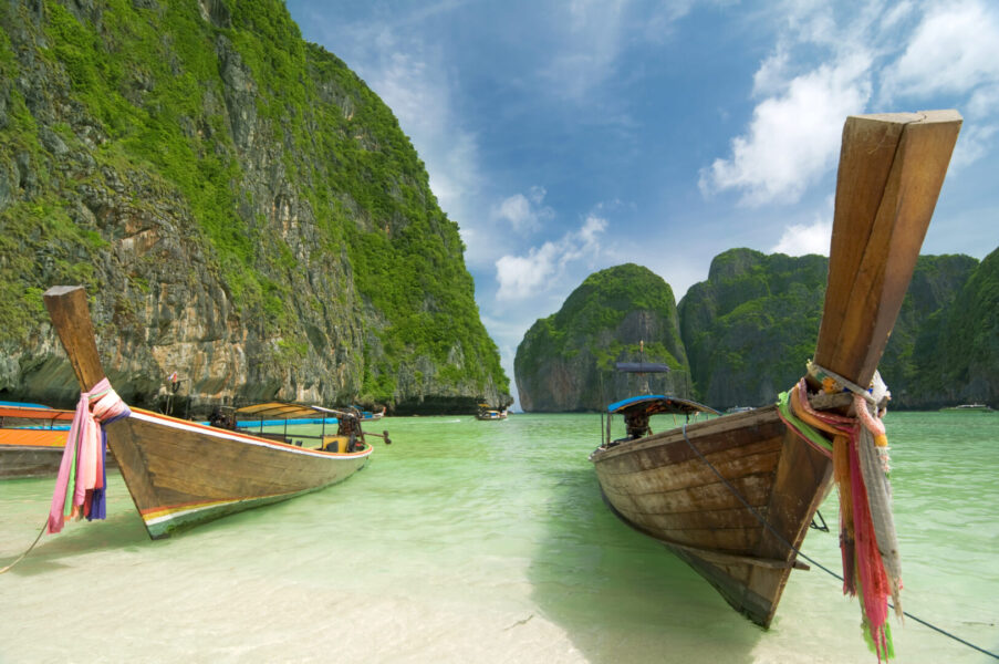 Long tail boats on the beach on an island